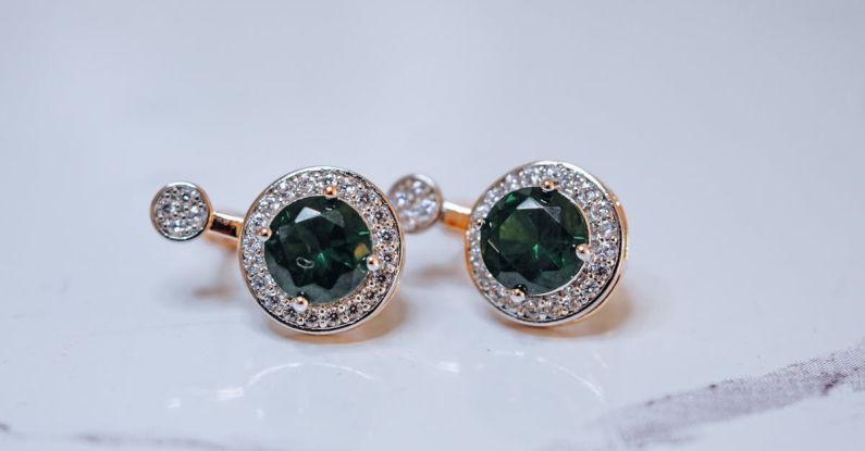 Holistic Wealth - A pair of green and white diamond earrings