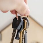 Diversification Investment - Person with keys for real estate