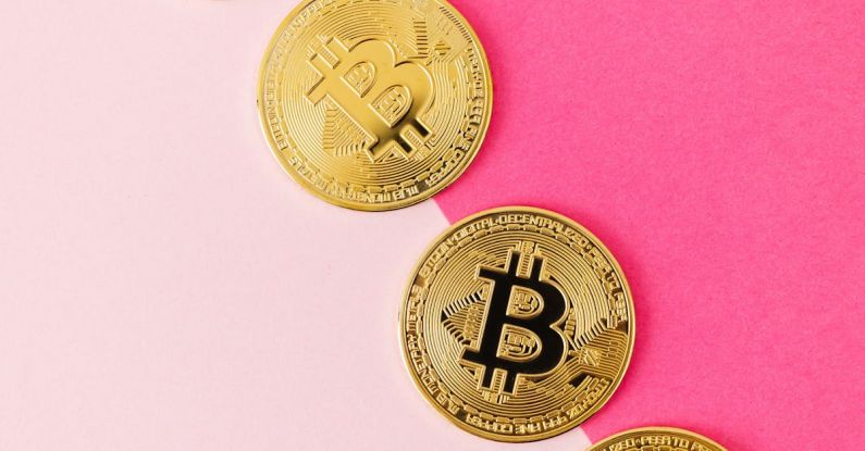 Blockchain Technology - Gold Round Coins on Pink Surface