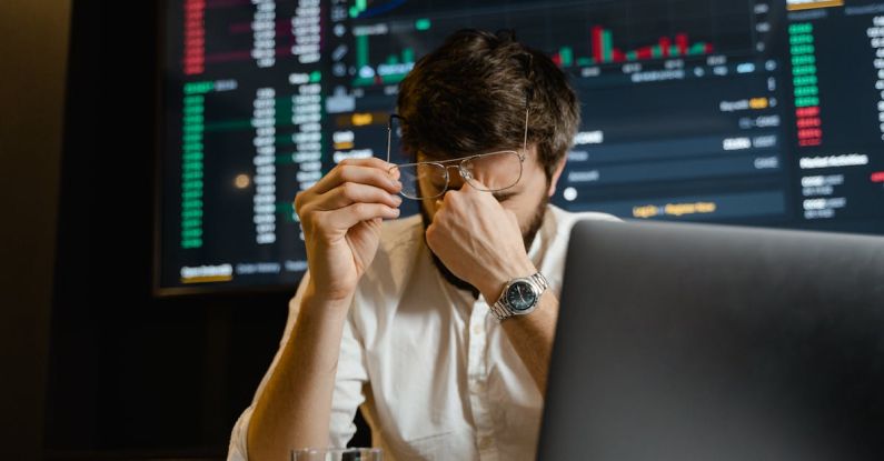 Crypto Tax - Man in White Dress Shirt Using Black Laptop Computer