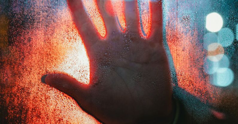 Risks Rewards - Hand Touching Glass