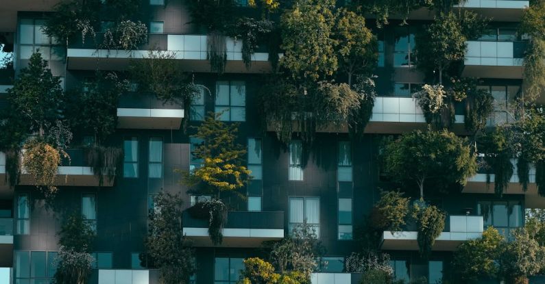 ICO Investment - Modern residential building facade decorated with green plants