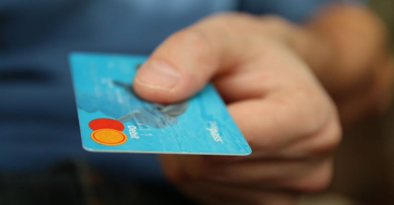 Debt Reduction - Person Holding Debit Card