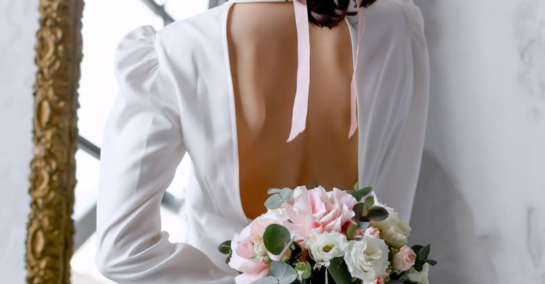 Life Events - Rear View of Bride Holding Bouquet