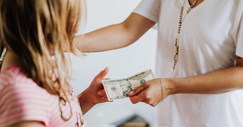 Kids Finance - Woman Giving 10 Dollars to a Girl