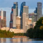 Roadmap Finance - A city skyline with tall buildings and trees in the background