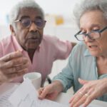 Robo-advisor - Two Seniors Looking at Papers