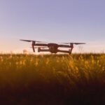Agriculture Technology - Black Quadcopter Drone on Green Grass Field