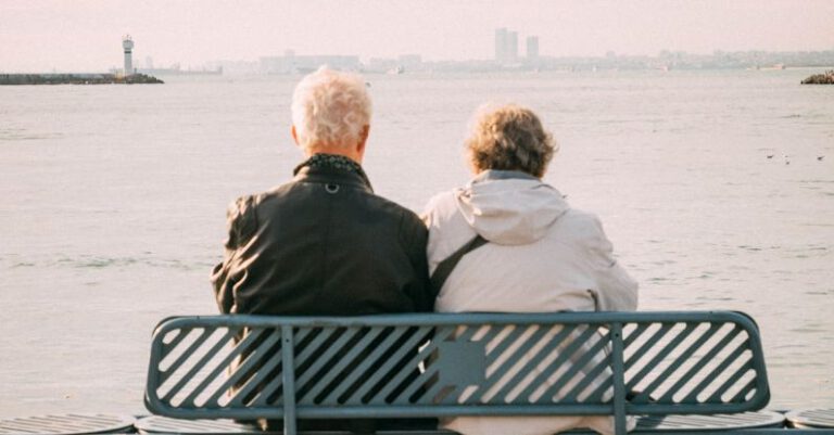 Mistakes Retirement - Elderly Couple Sitting on Bench in Seaside