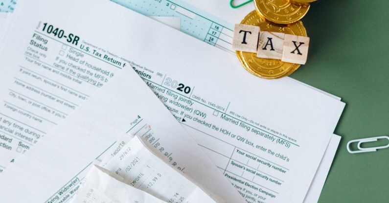 Balance Savings - Tax Documents on the Table