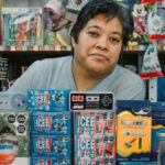 Retail Startup - A woman sitting in a store with a bunch of toys