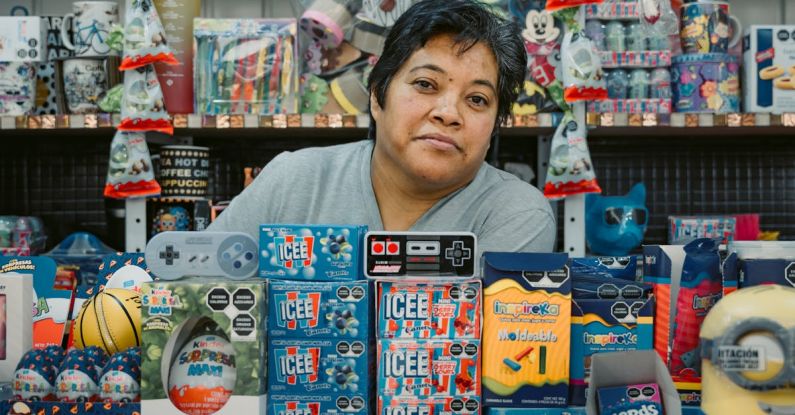 Retail Startup - A woman sitting in a store with a bunch of toys