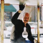 Market Cycles - Elderly Seller of Street Food Standing by Stall