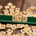 Diversification - The word etf on a wooden board with scrabble tiles