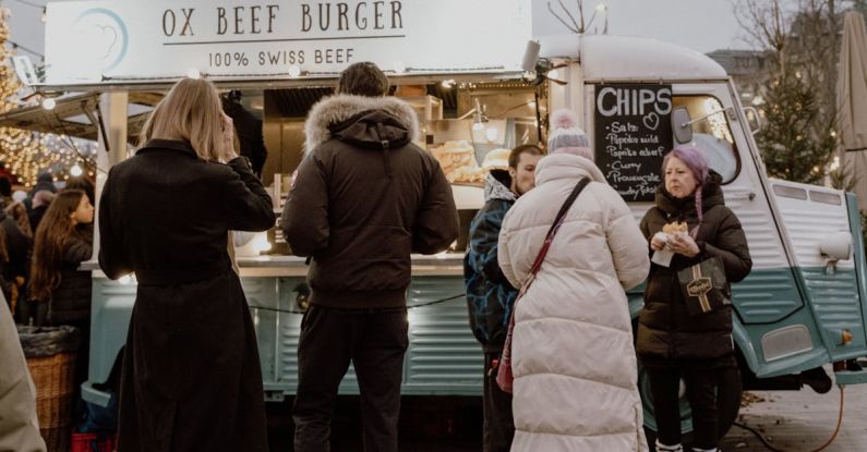 Volatile Market - People by the Food Truck on a Street