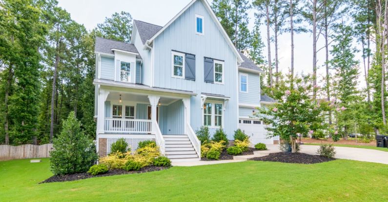 Rental Property - Blue House on Green Lawn