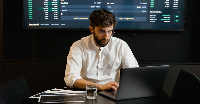 Crypto Diversification - Focused Professional Man using Laptop