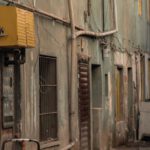 Recession Proof - A street with a cart and a building