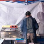 Asian Market - Cook Preparing a Street Food Stand at the Marketplace