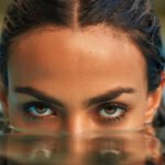 Emerging Markets - Photo of a Woman Emerging from the Water in a Swimming Pool