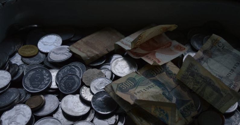 Retirement Savings - A tray full of coins and money